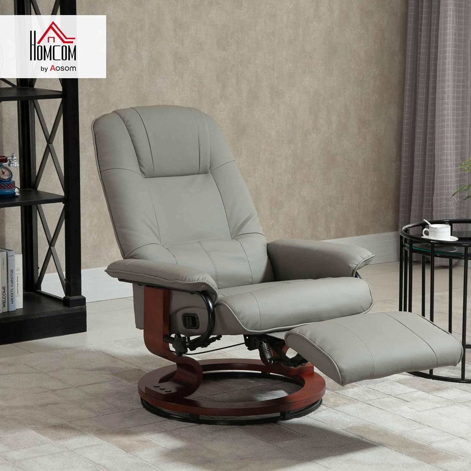 Swivel recliner. PU leather recliner featuring a retractable footrest.